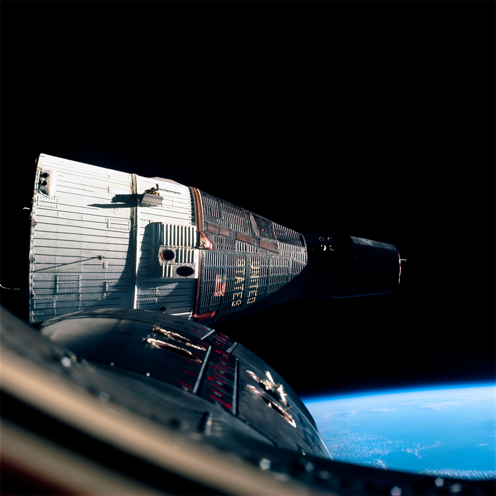 Gemini 7 meets Gemini 6A in space. Gemini 7 meets Gemini 6A in space.