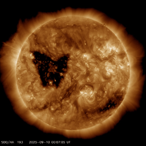 A butterfly-shaped hole on the solar surface. A butterfly-shaped hole on the solar surface.