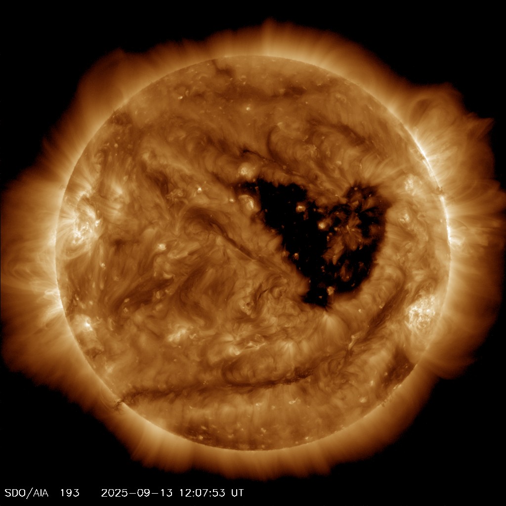 Another image of the sun with a heart shaped coronal hole near the middle of the solar disk.