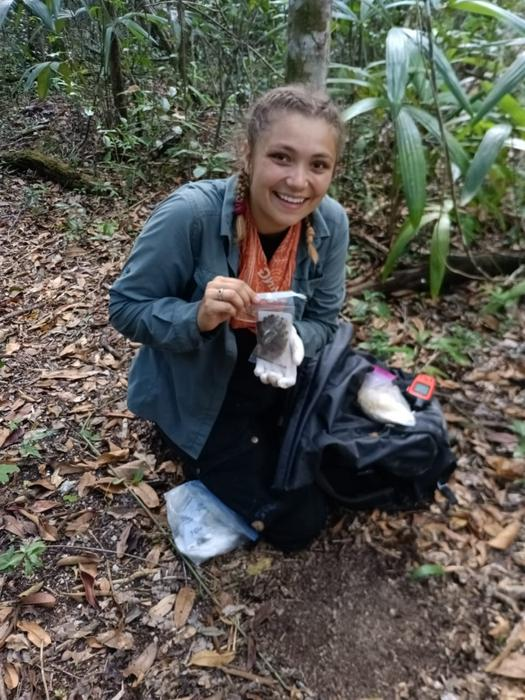Zoologists get ridiculously excited about finding droppings, in this case Ellen Dymit with cat scat. Zoologists get ridiculously excited about finding droppings, in this case Ellen Dymit with cat scat.